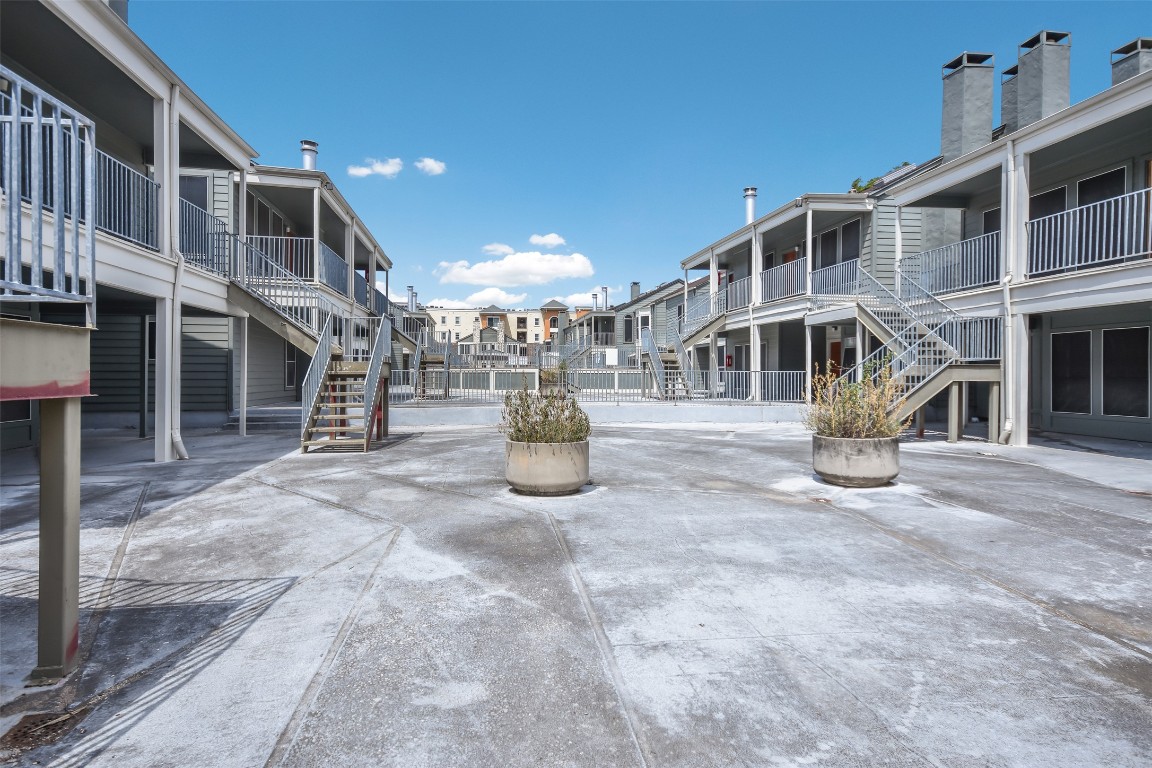 2529 Rio Grande Street, Unit 85 Austin, TX 78705 - Photo 25 of 31 a view of a building with a yard