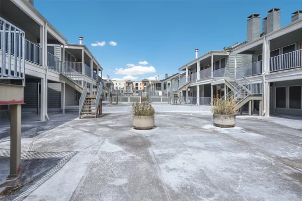 a view of a building with a yard