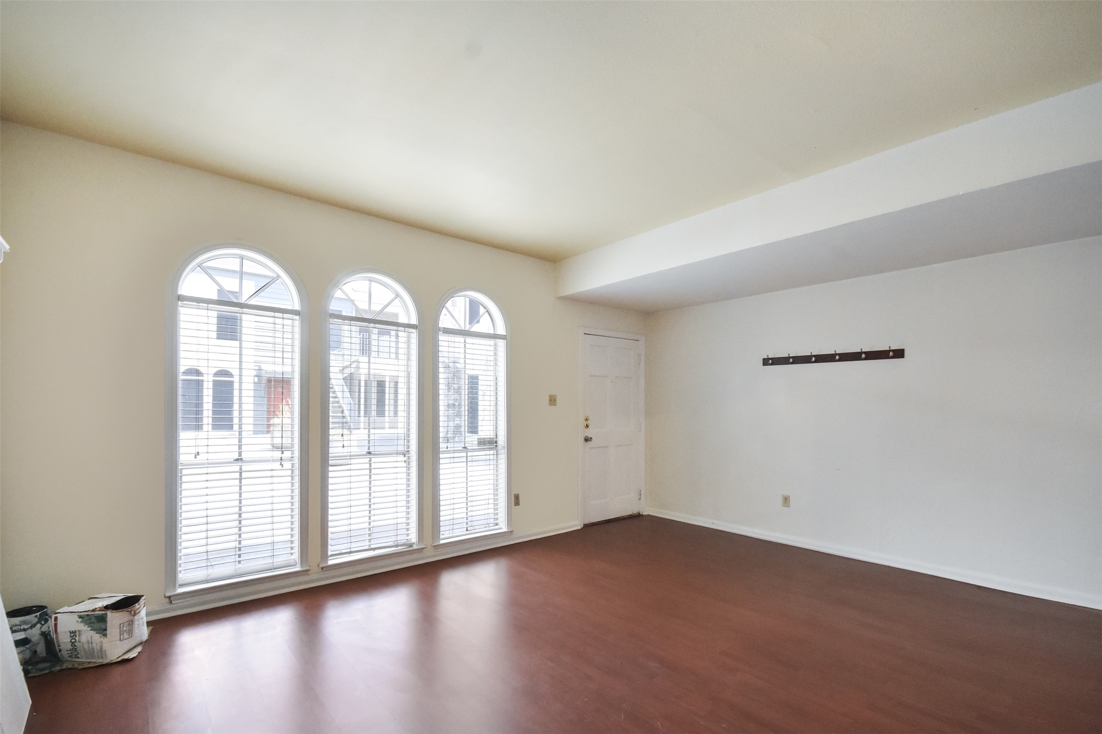 2529 Rio Grande Street, Unit 85 Austin, TX 78705 - Photo 3 of 31 an empty room with wooden floor and windows