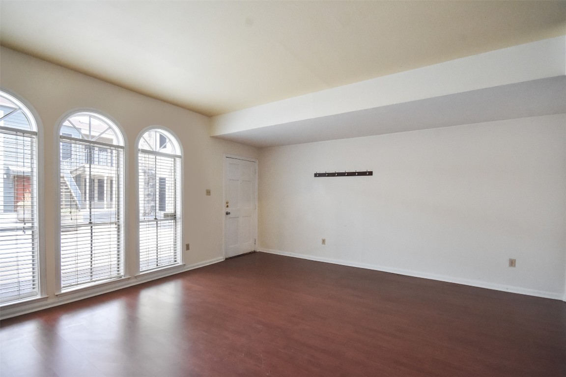 2529 Rio Grande Street, Unit 85 Austin, TX 78705 - Photo 5 of 31 a view of empty room with wooden floor and fan