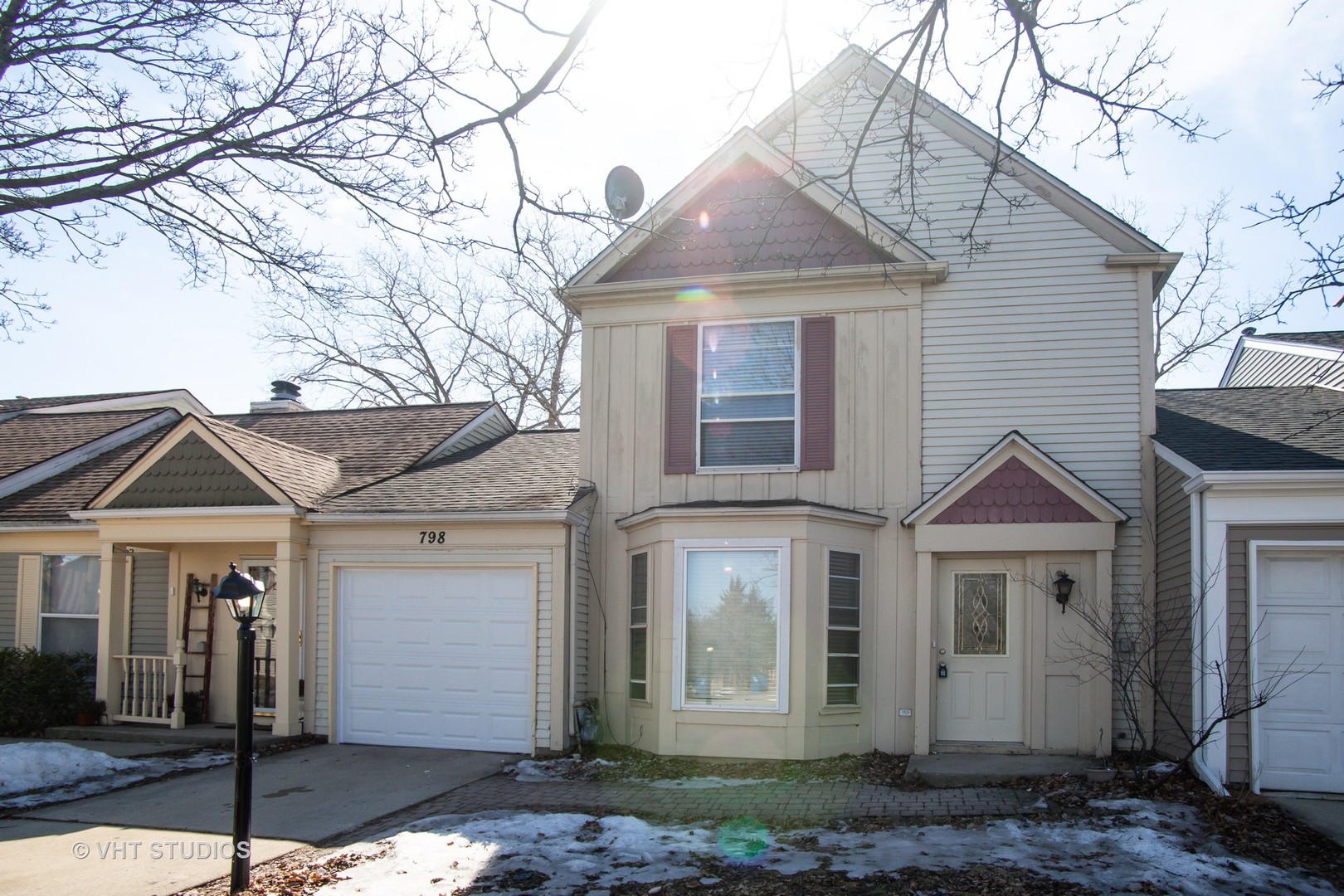 798 Roosevelt Road, Unit 1 Hanover Park, IL 60133 - Photo 1 of 10 a front view of a house with a yard