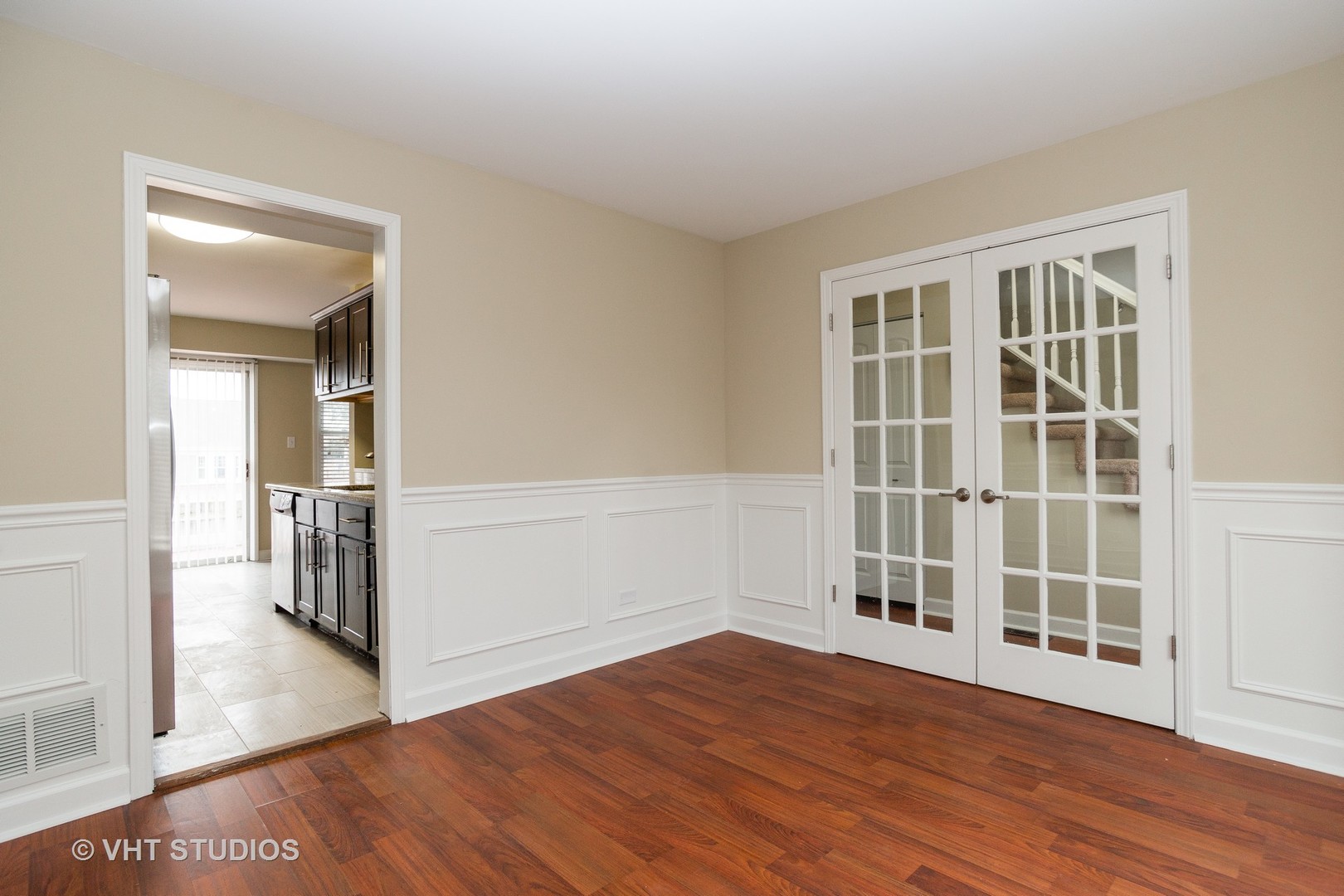 798 Roosevelt Road, Unit 1 Hanover Park, IL 60133 - Photo 7 of 10 wooden floor in an empty room with a window and wooden floor