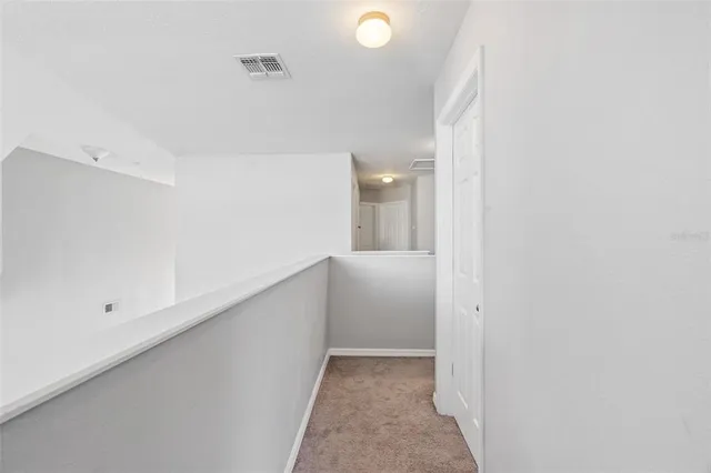 a view of a hallway with closet