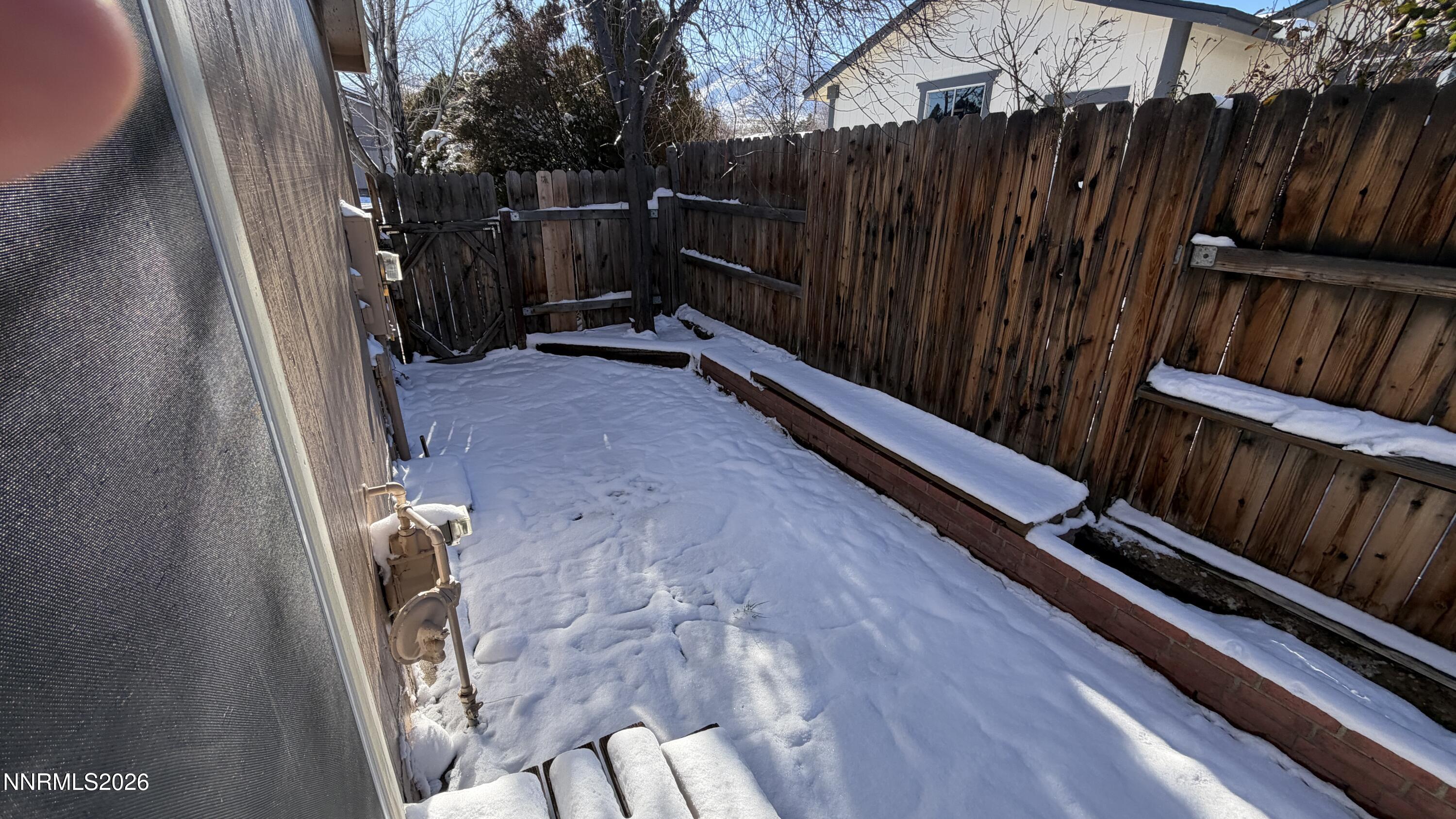 6451 Flower Street Reno, NV 89506 - Photo 12 of 14 a view of outdoor space with deck and yard