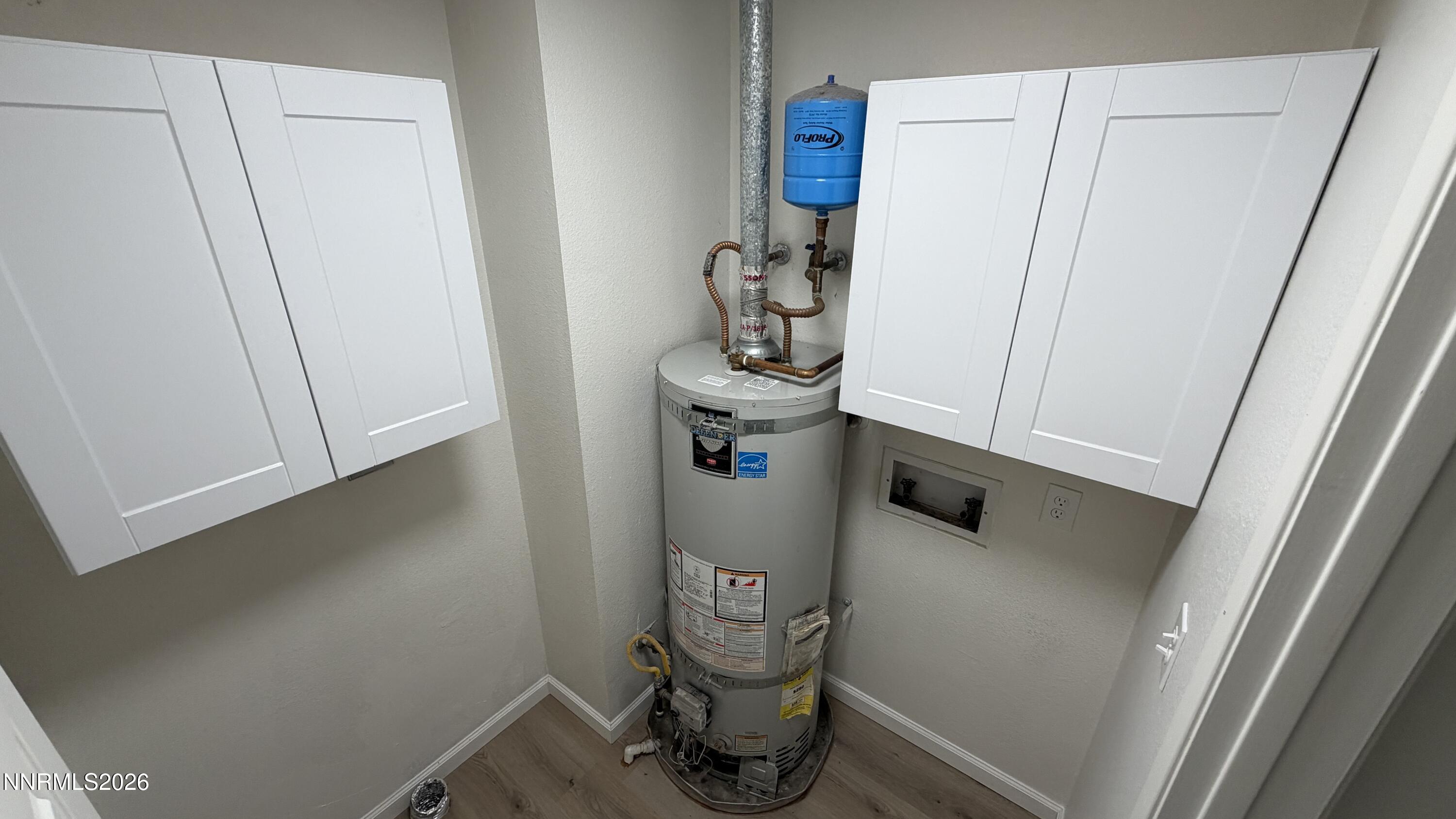 6451 Flower Street Reno, NV 89506 - Photo 5 of 14 a room with a walk in closet and wooden floor