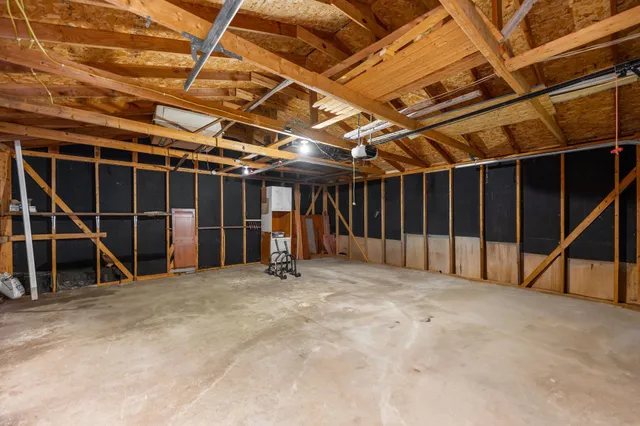 a view of an empty room with gym equipment