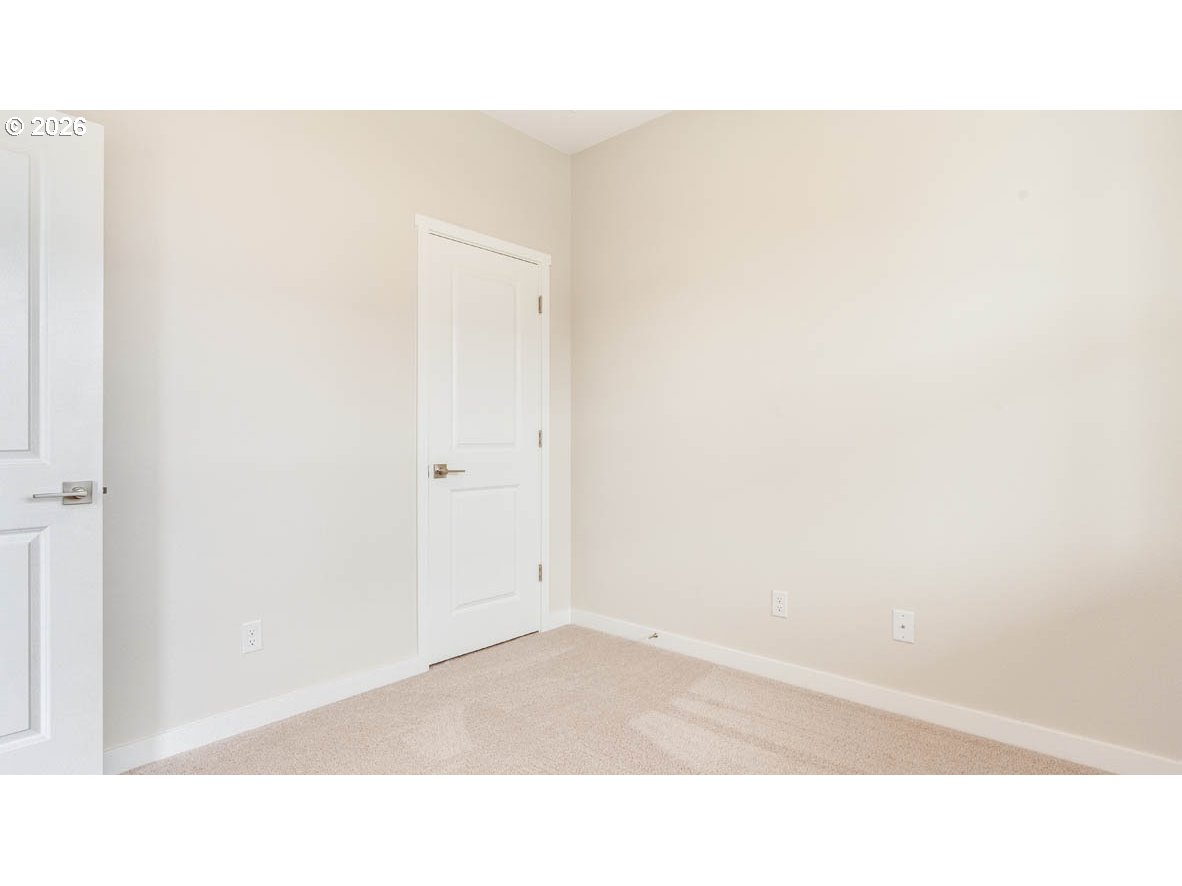 9194 Southeast Azalea Street Happy Valley, OR 97086 - Photo 12 of 32 a open space with a window