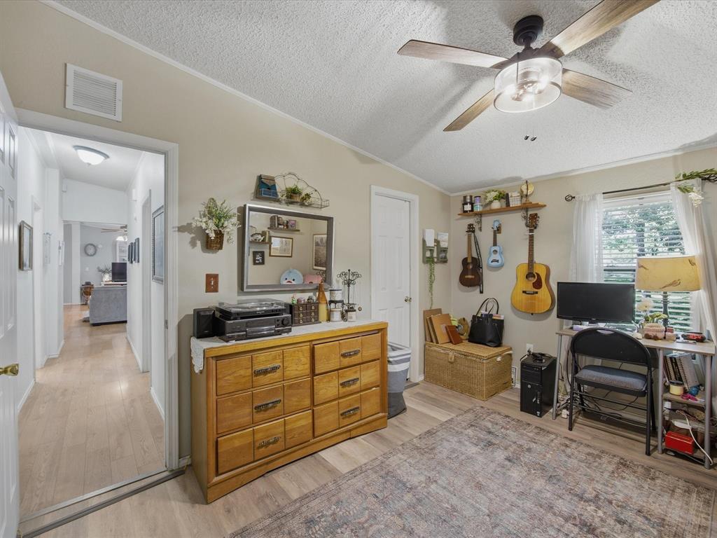 3275 Finis Road Graham, TX 76450 - Photo 21 of 36 a spacious bedroom with a bed and furniture