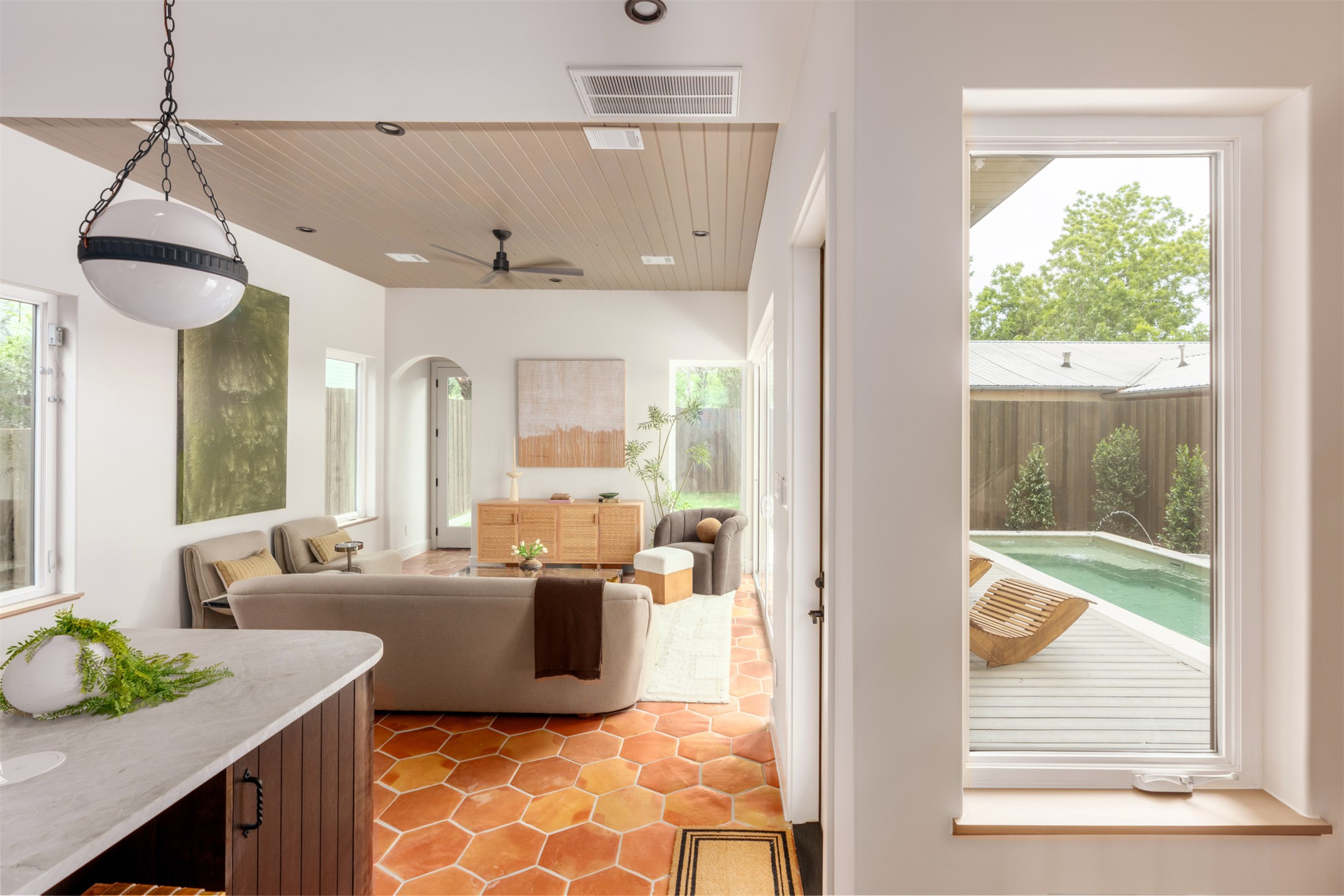 4713 Bolm Road Austin, TX 78702 - Photo 17 of 40 Bright interior space featuring hexagonal terracotta tile flooring and a wood-panel ceiling