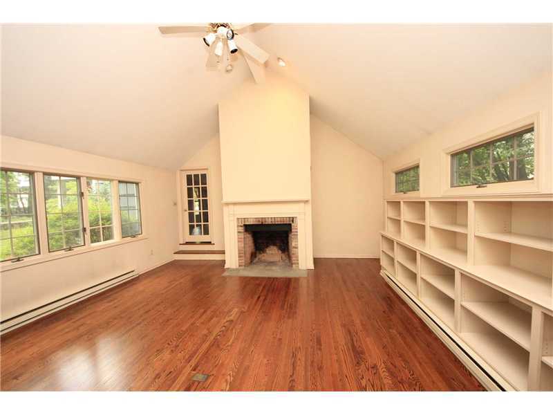 178 Tokeneke Road Darien, CT 06820 - Photo 5 of 22 a view of an empty room with a window and wooden floor