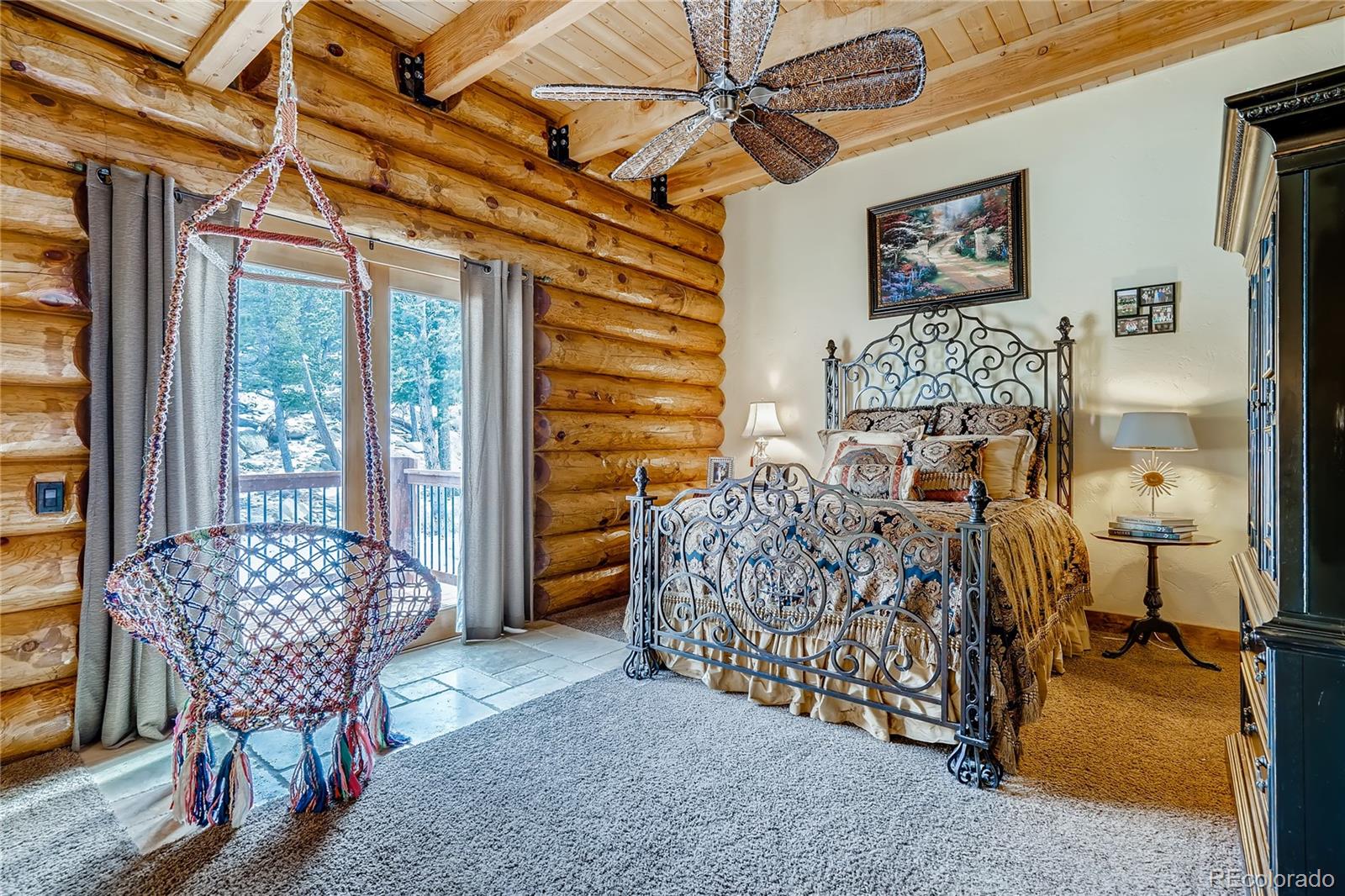 11200 Shimley Road Golden, CO 80403 - Photo 15 of 40 a bedroom with furniture and a window