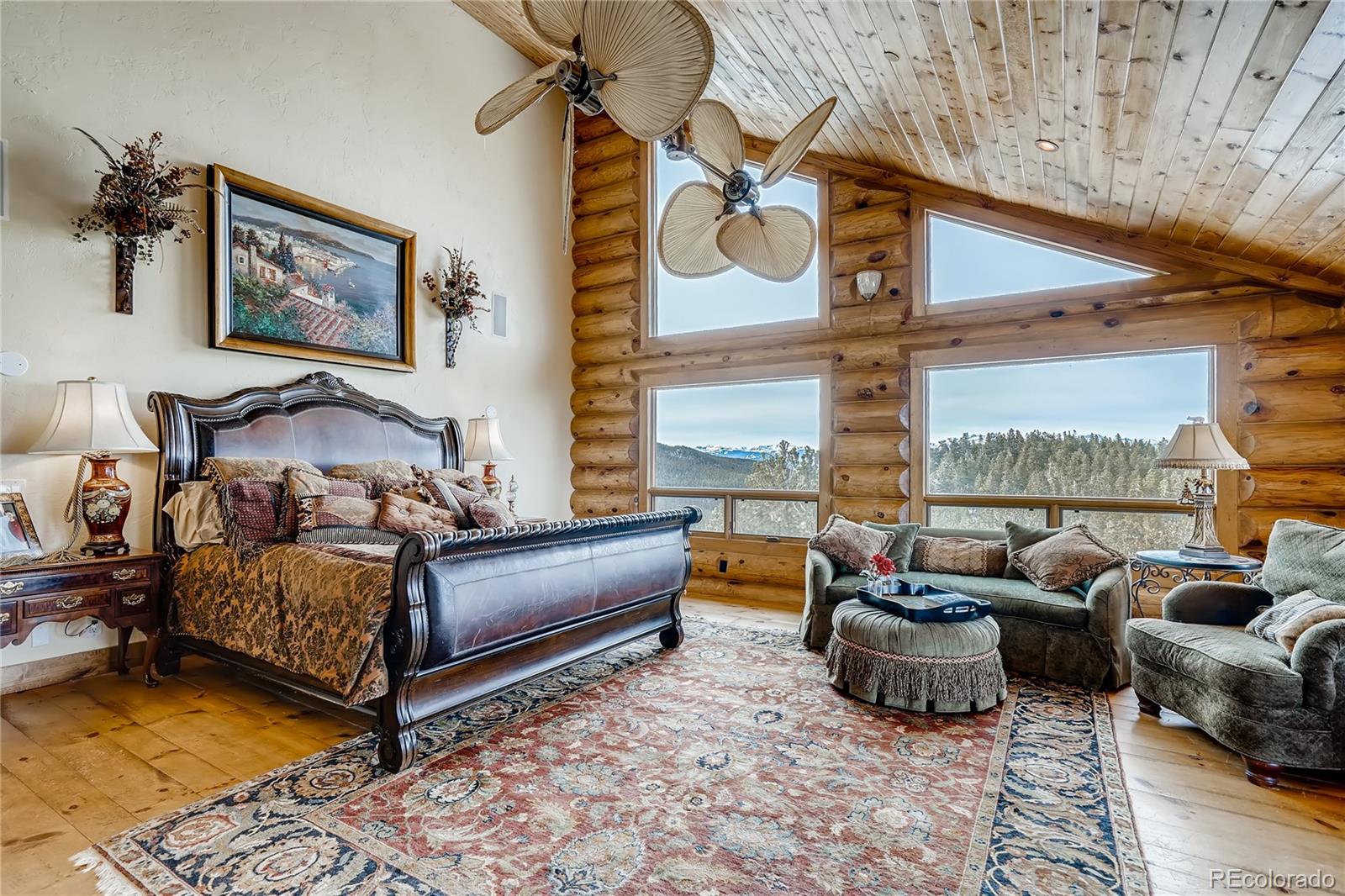 11200 Shimley Road Golden, CO 80403 - Photo 20 of 40 a bedroom with furniture and a large window