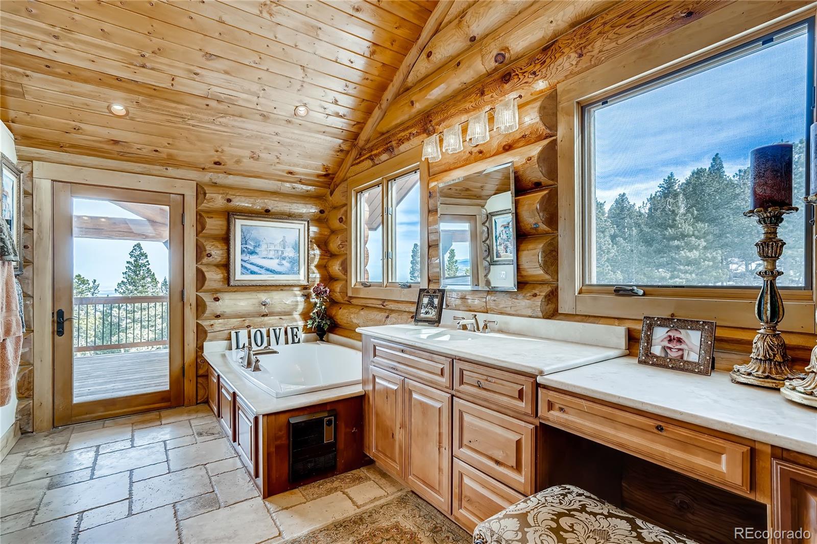 11200 Shimley Road Golden, CO 80403 - Photo 21 of 40 a large kitchen with kitchen island a large window in it