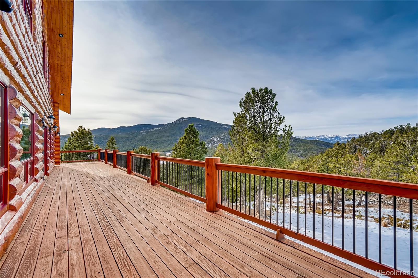 11200 Shimley Road Golden, CO 80403 - Photo 31 of 40 a view of balcony with wooden floor and fence