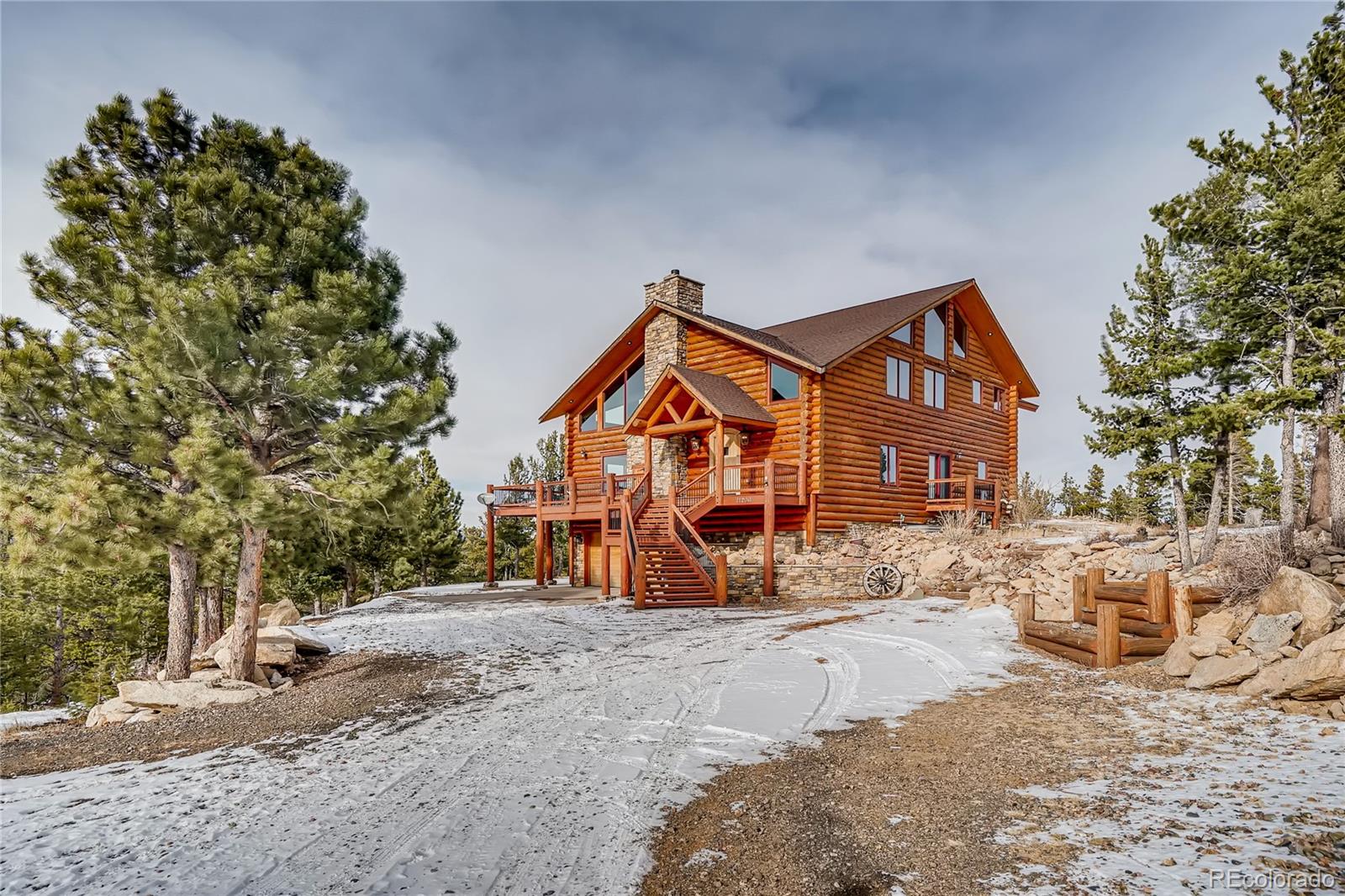 11200 Shimley Road Golden, CO 80403 - Photo 38 of 40 a view of large house with a snow in the background