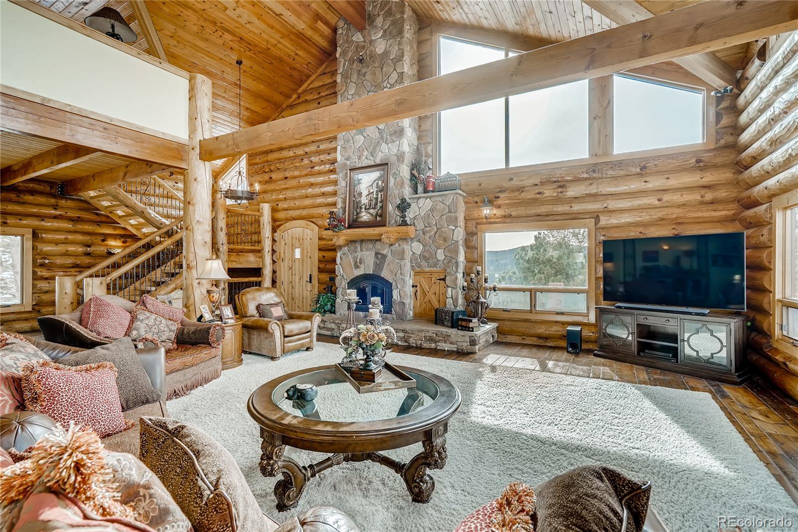 11200 Shimley Road Golden, CO 80403 - Photo 6 of 40 a view of a patio with dining table and chairs with wooden floor