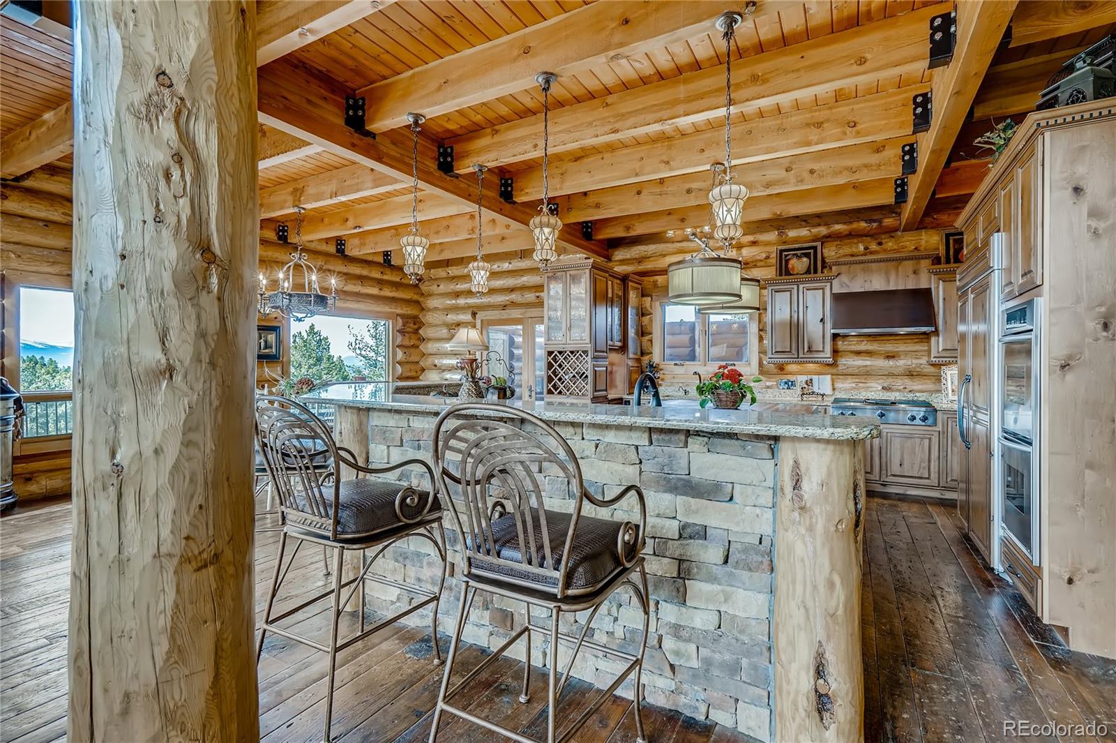 11200 Shimley Road Golden, CO 80403 - Photo 7 of 40 a view of a chairs and table in a patio
