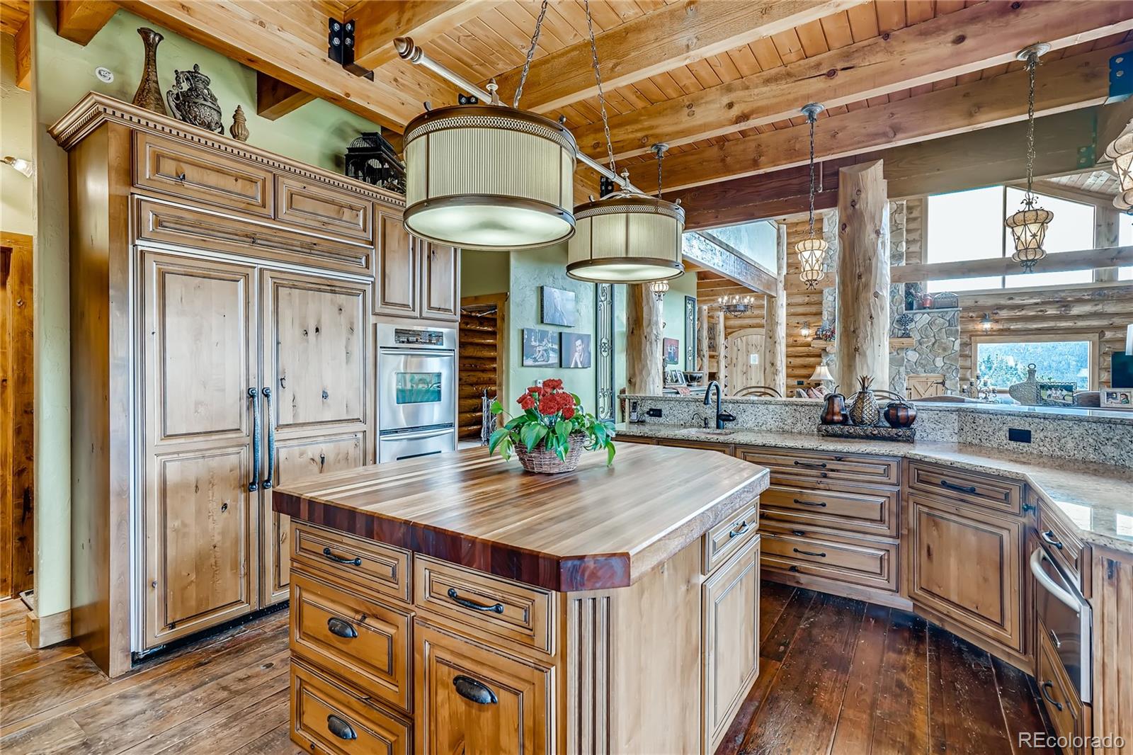 11200 Shimley Road Golden, CO 80403 - Photo 8 of 40 a kitchen view with stainless steel appliances granite countertop a sink and cabinets