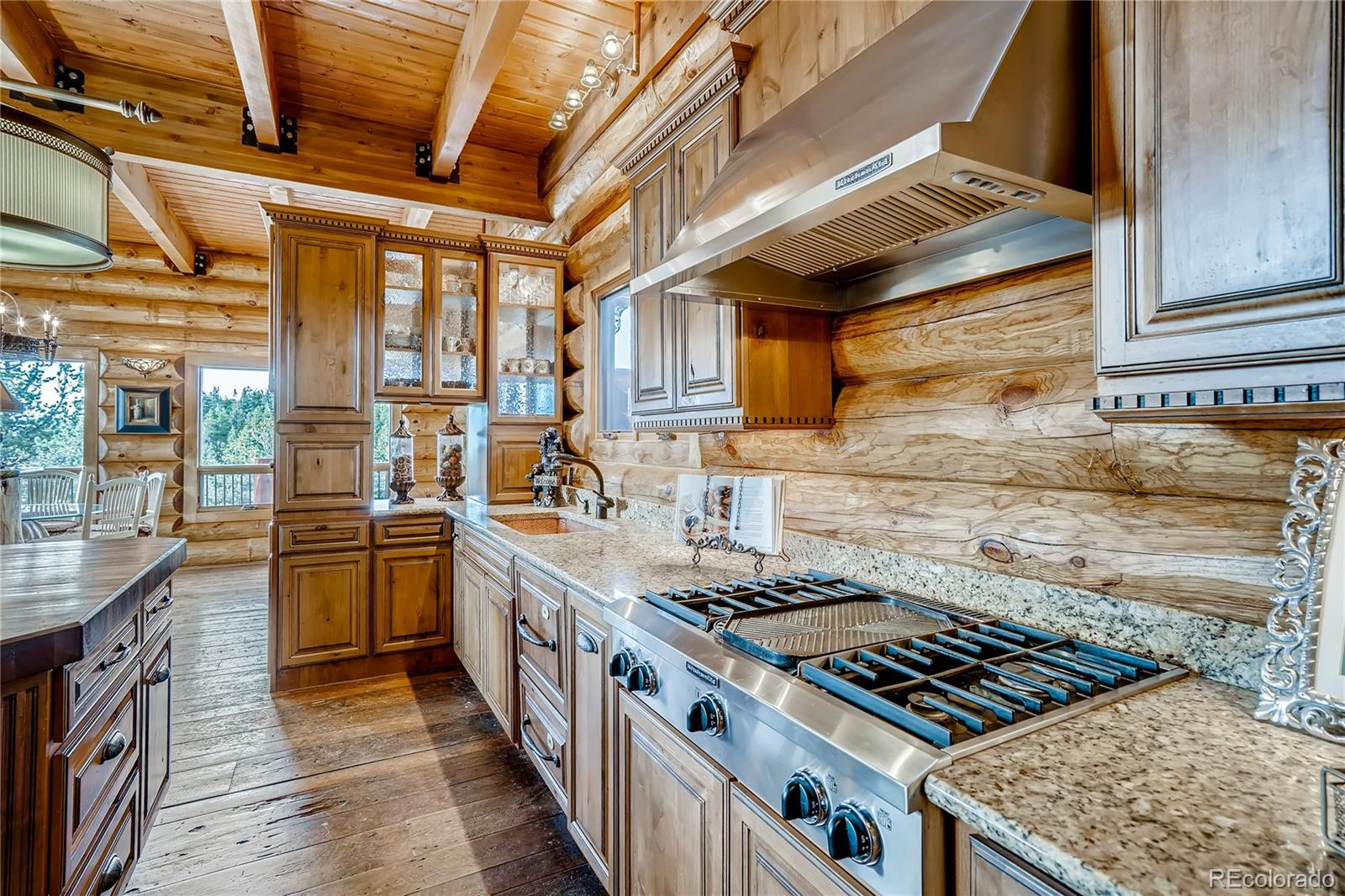 11200 Shimley Road Golden, CO 80403 - Photo 10 of 40 a kitchen with stainless steel appliances granite countertop a stove and a sink