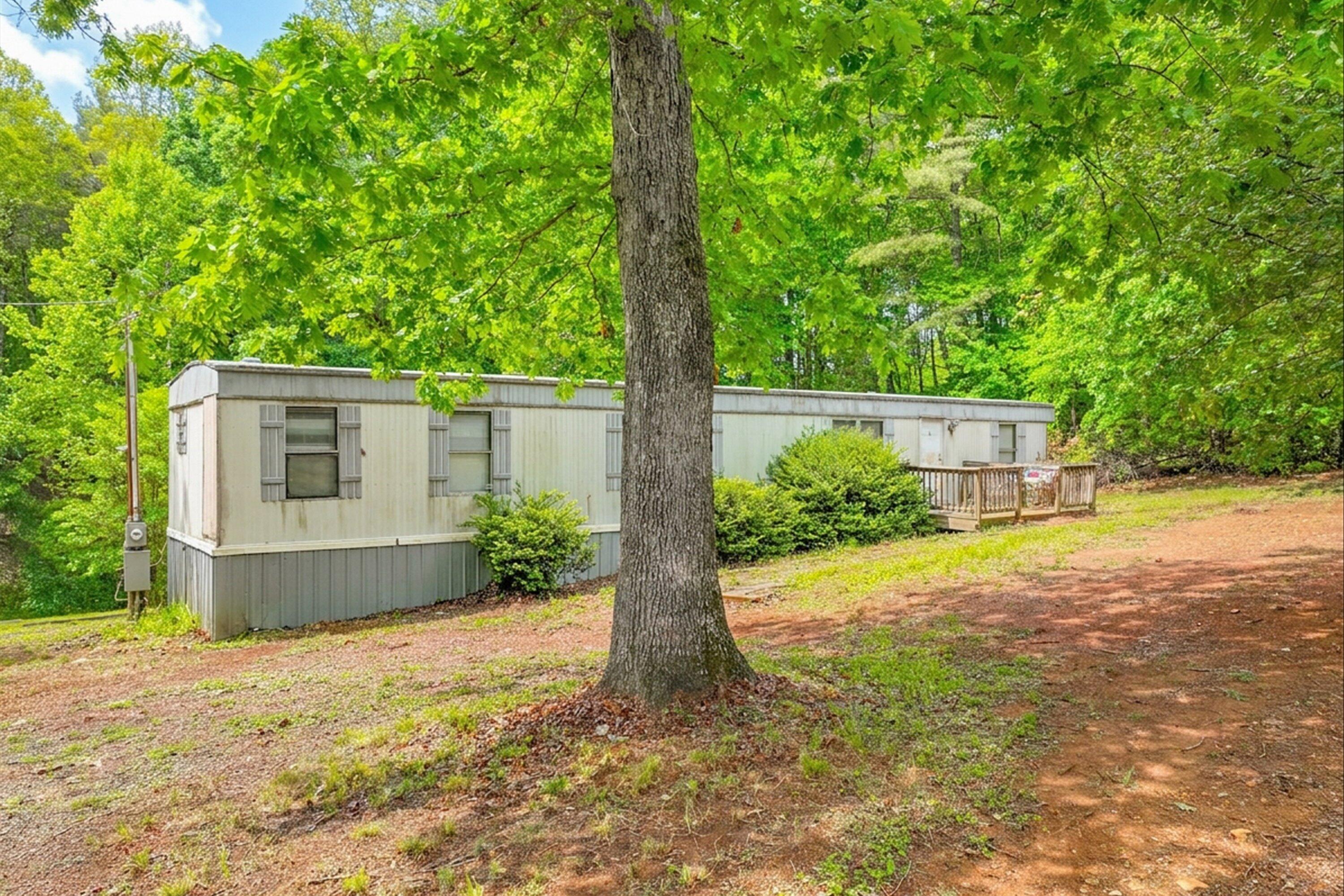 183 Pernello Road Ferrum, VA 24088 - Photo 11 of 24 a front view of a house with a yard and garage