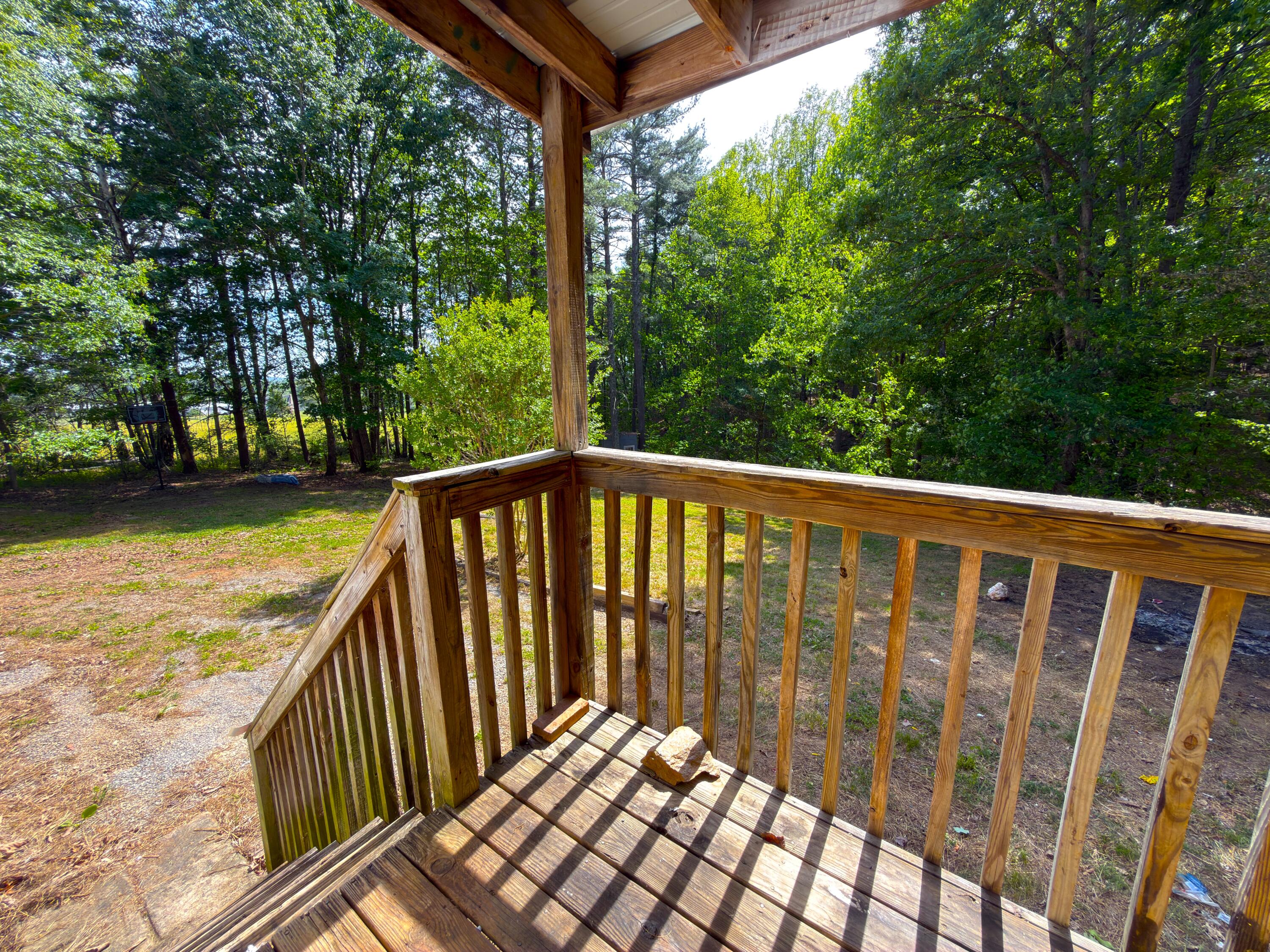 183 Pernello Road Ferrum, VA 24088 - Photo 21 of 24 a view of a wooden deck next to a yard
