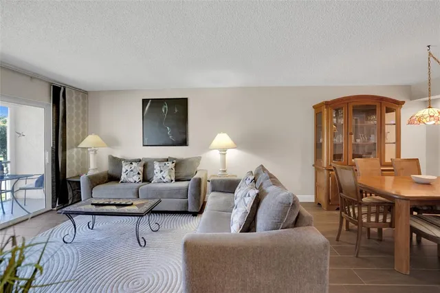 a bathroom with a sink a toilet a mirror a bathtub and shower