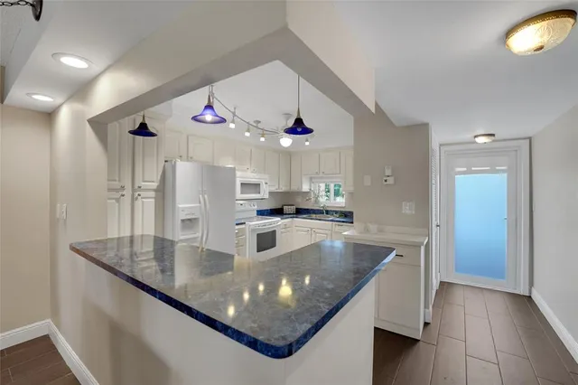 a bedroom with furniture and a large window