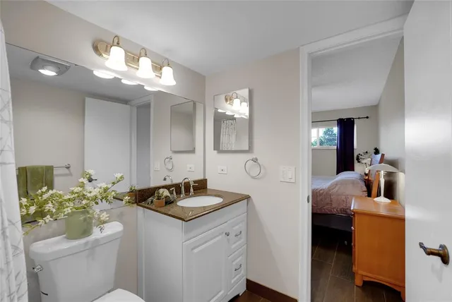 a room with pool table and windows