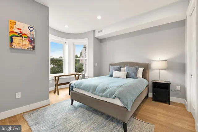 a bedroom with a bed and a couch