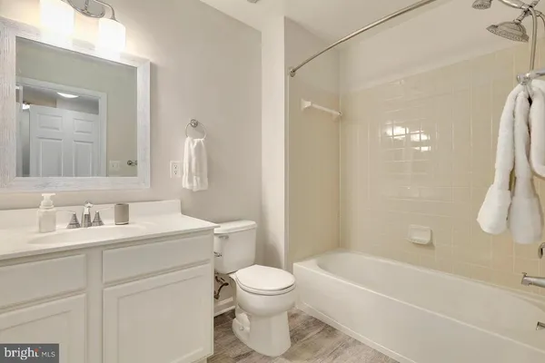 a bathroom with a toilet a sink and a bathtub