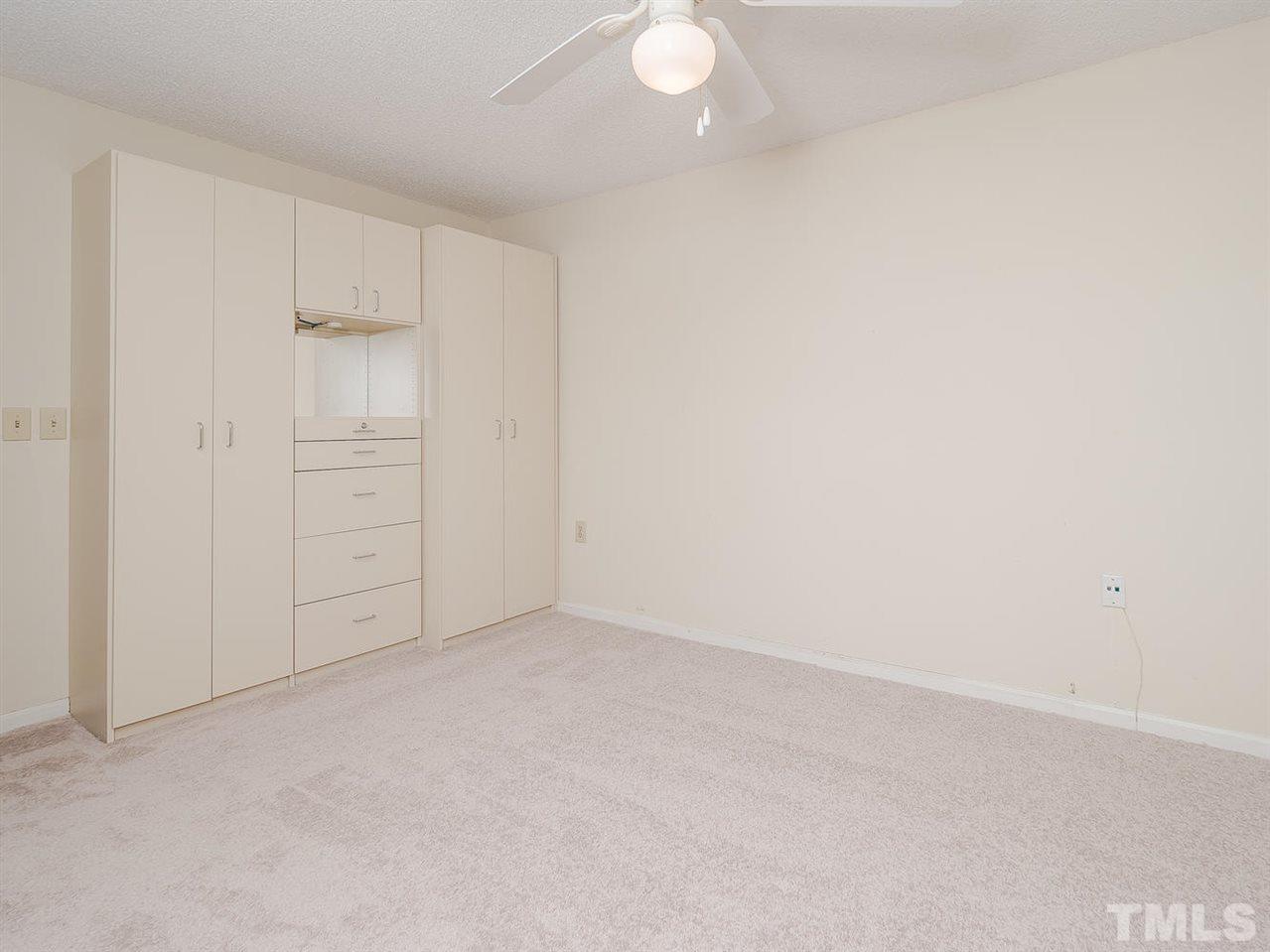 7756 Falcon Rest Circle, Unit 7756 Raleigh, NC 27615 - Photo 12 of 18 Master bedroom has custom built ins