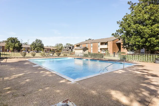 a view of a swimming pool with an outdoor space and seating area