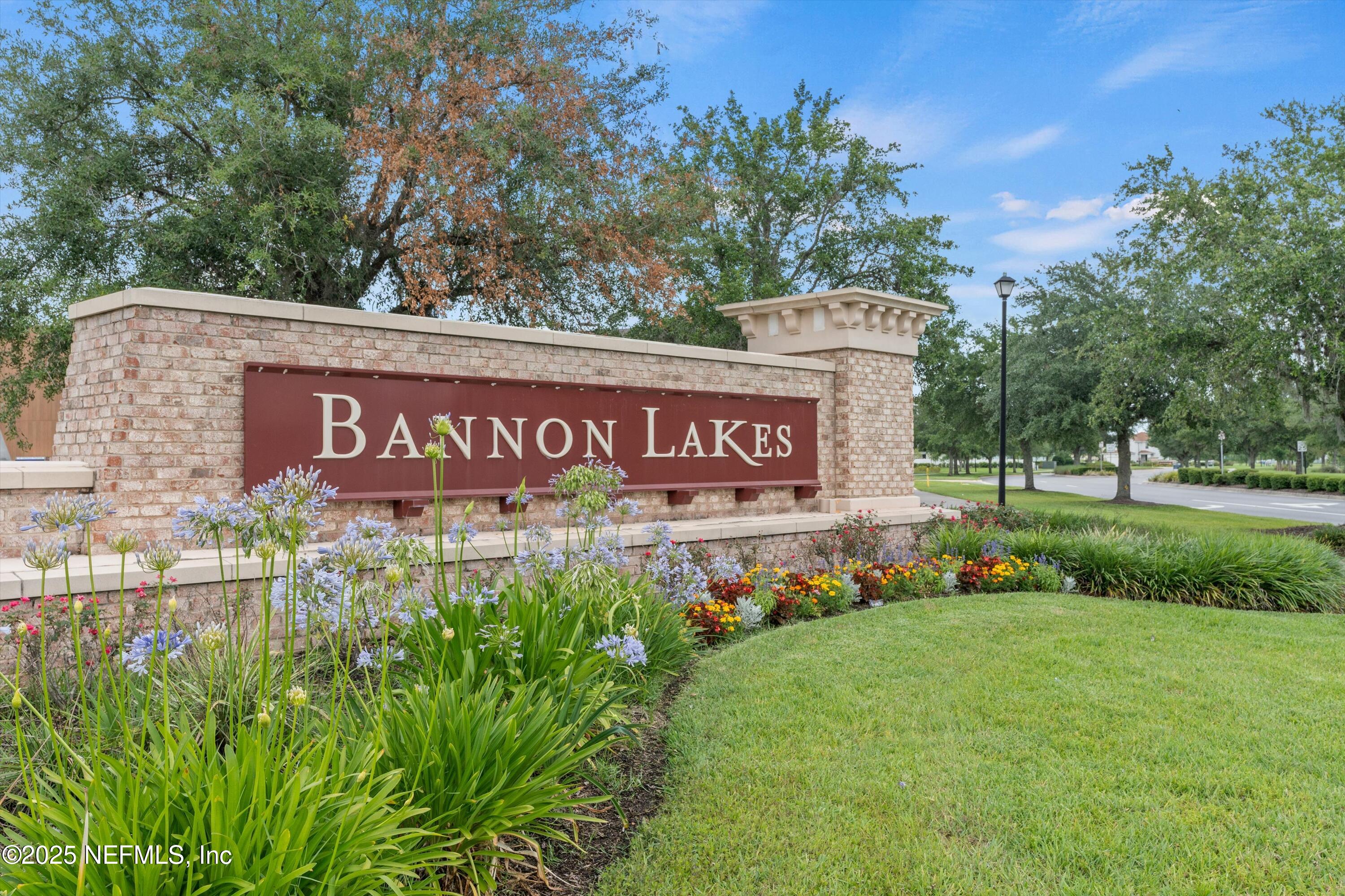 219 Bluejack Lane St. Augustine, FL 32095 - Photo 14 of 44 a sign that is sitting in front of flowers