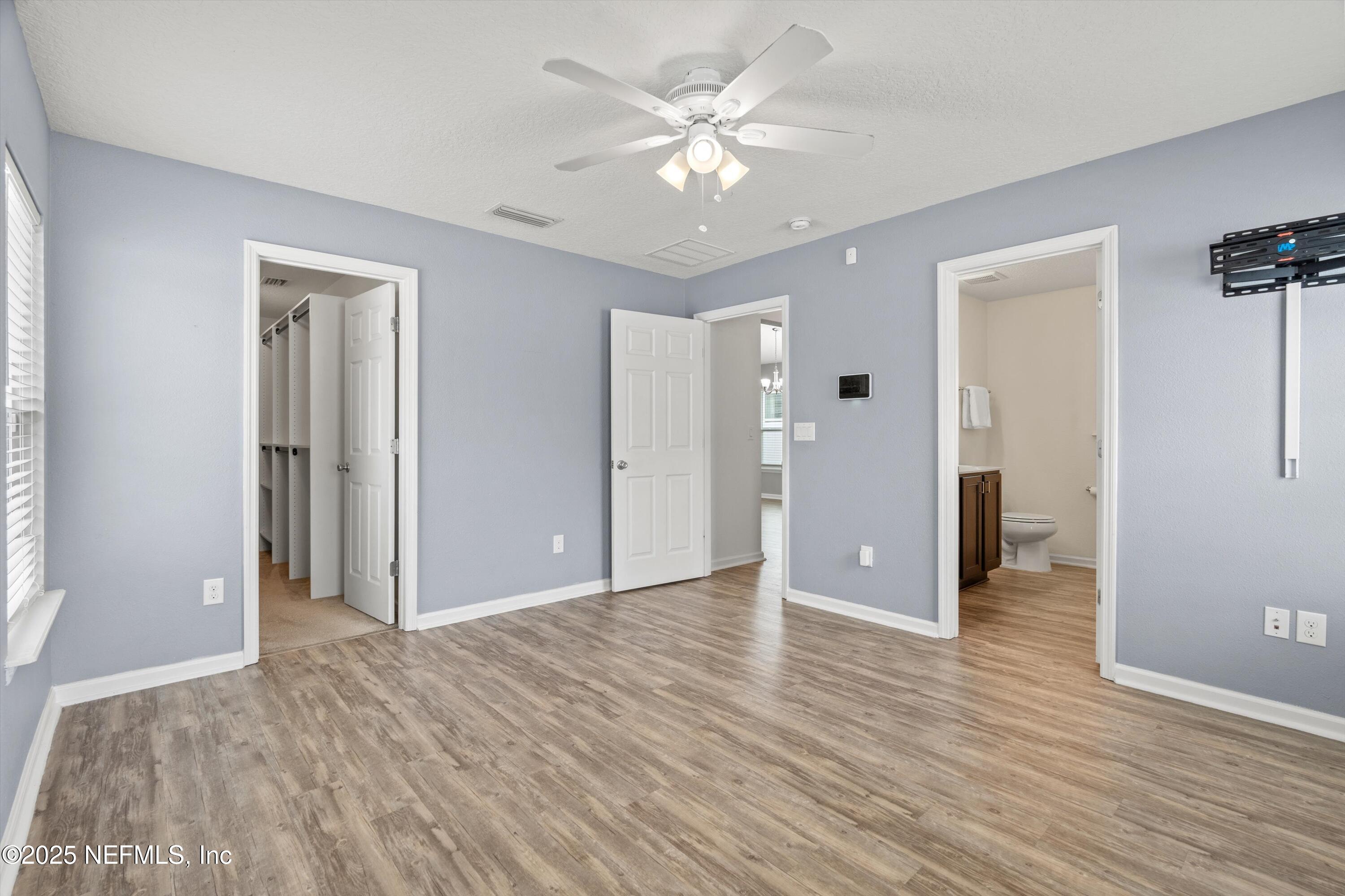 219 Bluejack Lane St. Augustine, FL 32095 - Photo 21 of 45 a view of an empty room with closet and a window