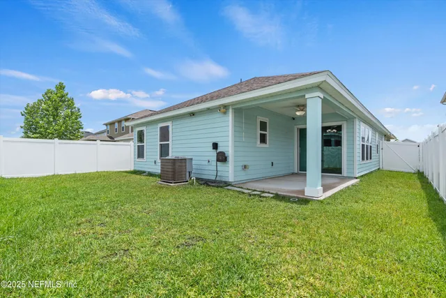 a view of a backyard with plants and a garden