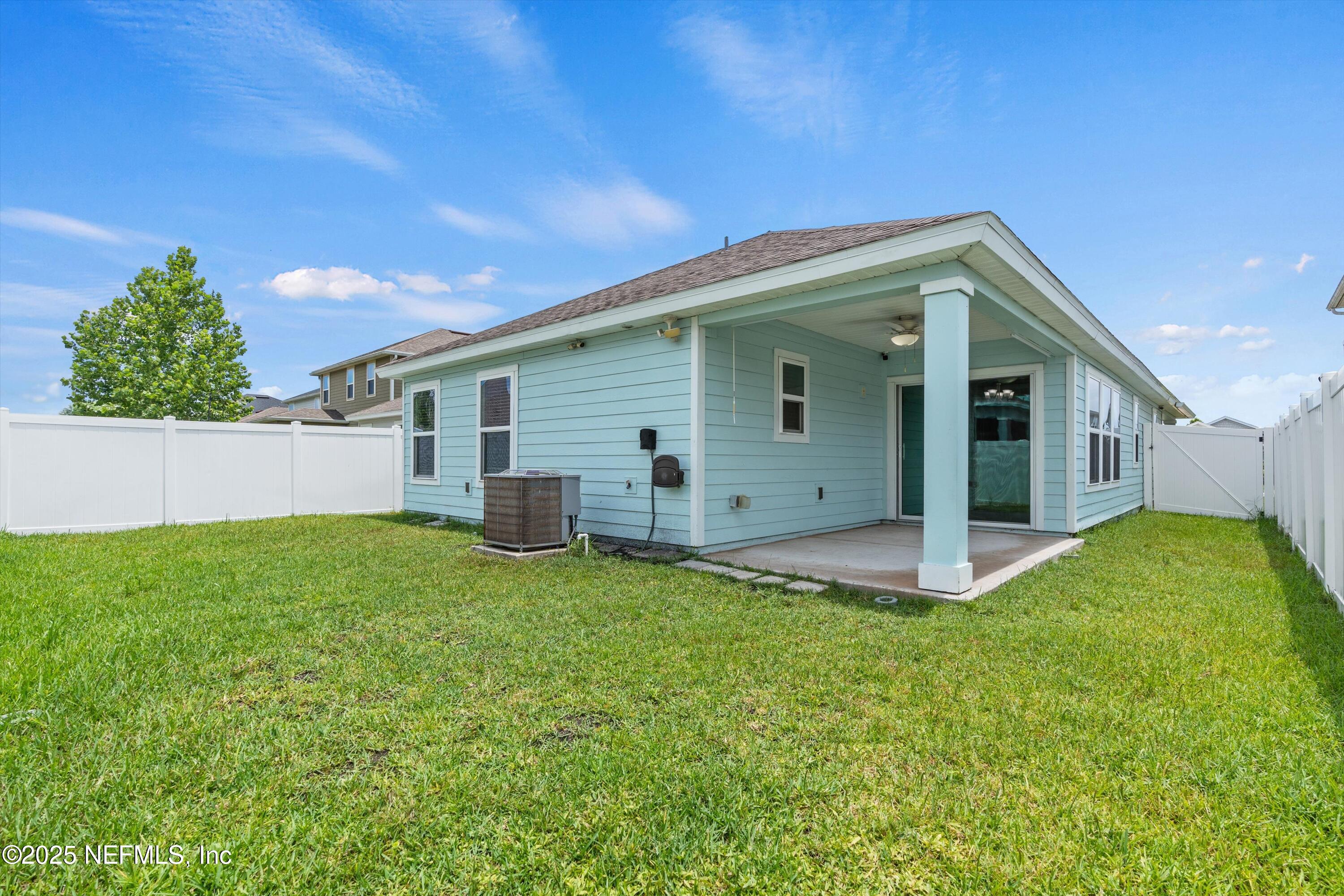 219 Bluejack Lane St. Augustine, FL 32095 - Photo 3 of 44 a view of a backyard with plants and a garden