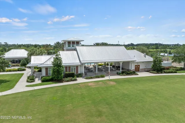 a view of a patio with table and chairs