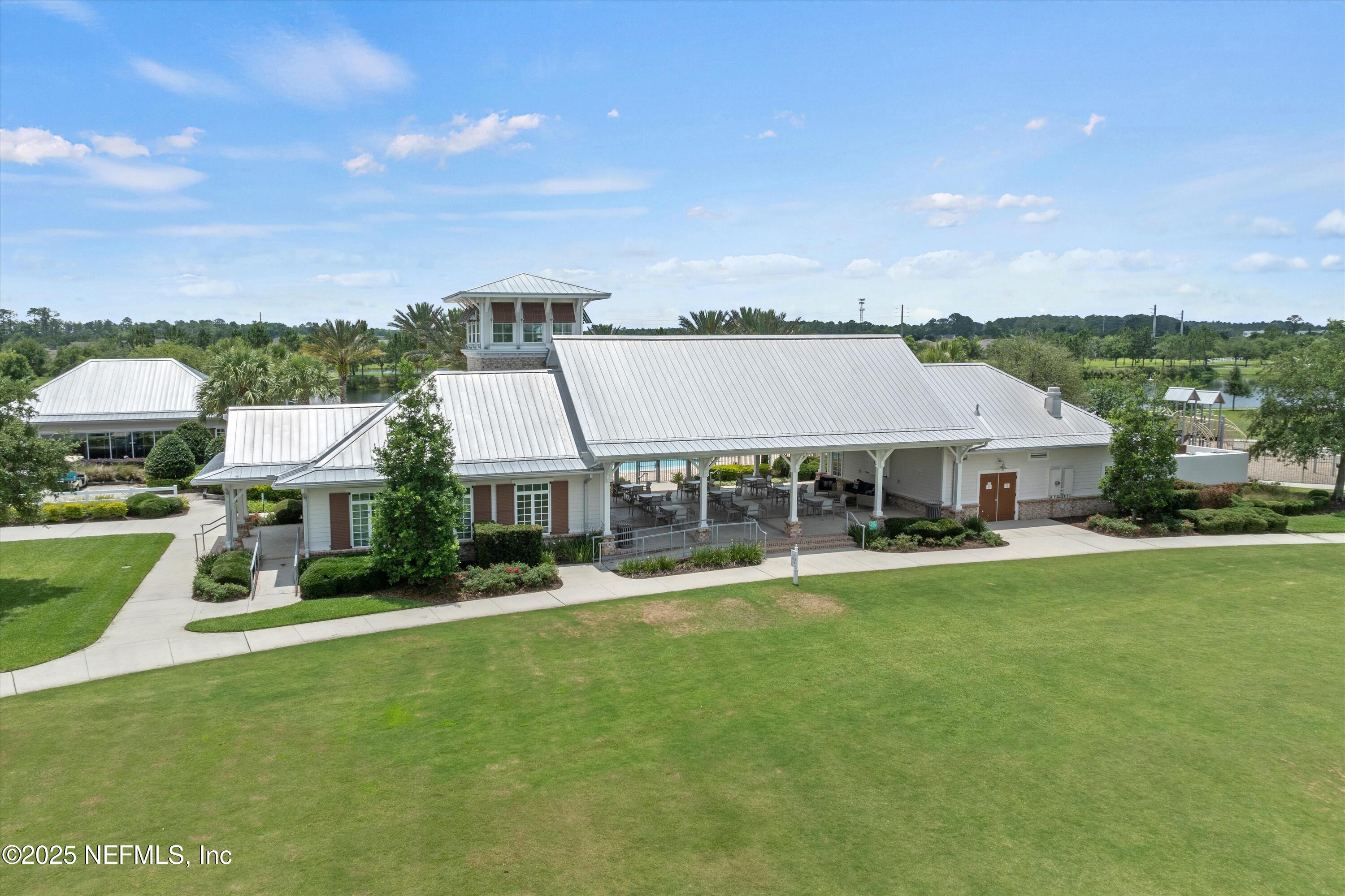 219 Bluejack Lane St. Augustine, FL 32095 - Photo 35 of 44 a view of a house with a big yard and large trees