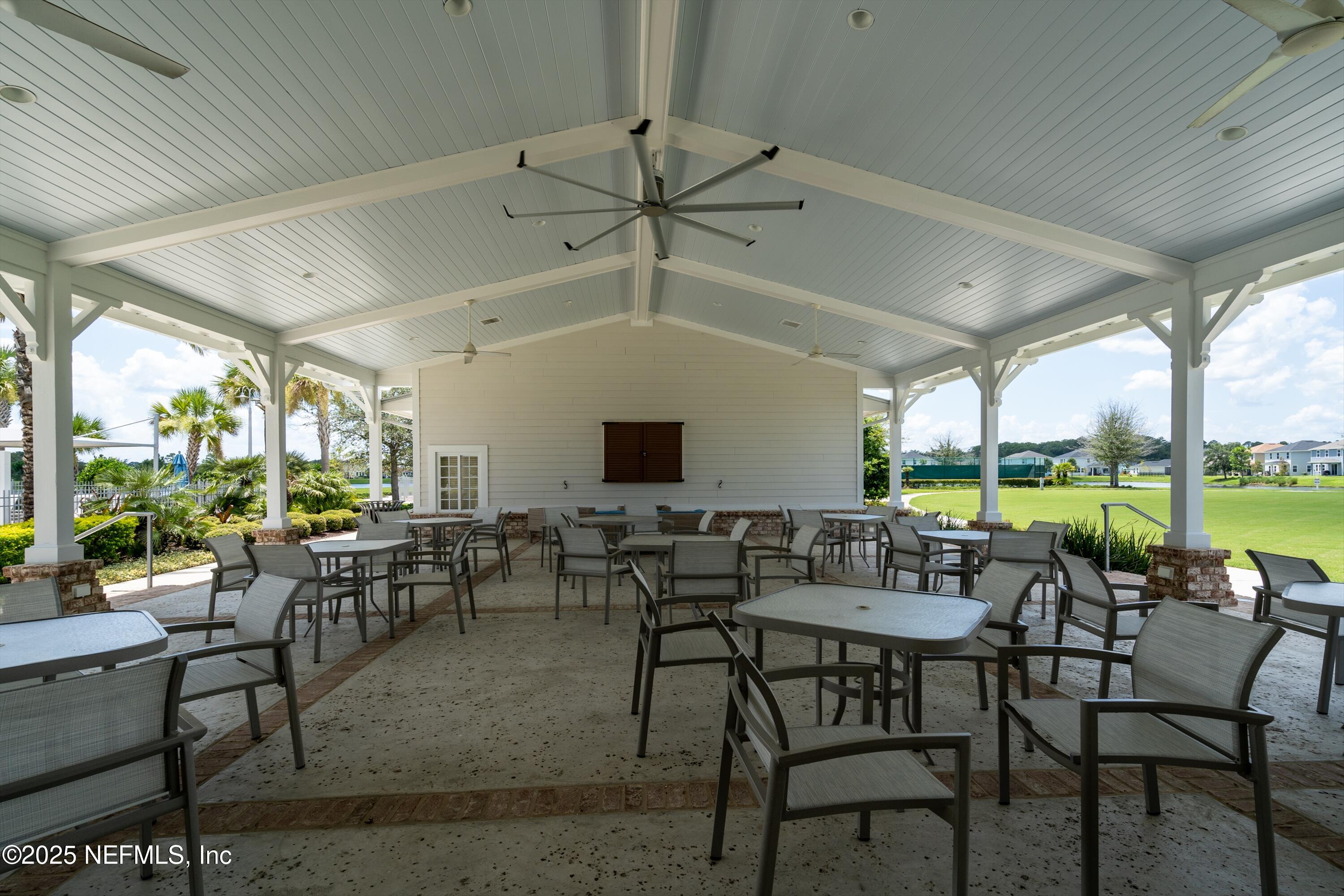 219 Bluejack Lane St. Augustine, FL 32095 - Photo 37 of 44 a view of a patio with table and chairs