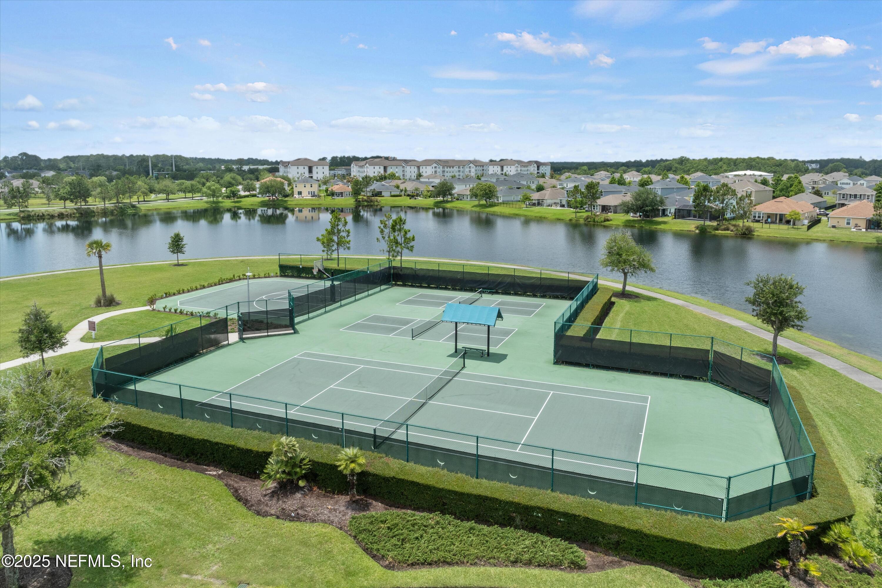 219 Bluejack Lane St. Augustine, FL 32095 - Photo 39 of 44 a view of a lake with houses in the back