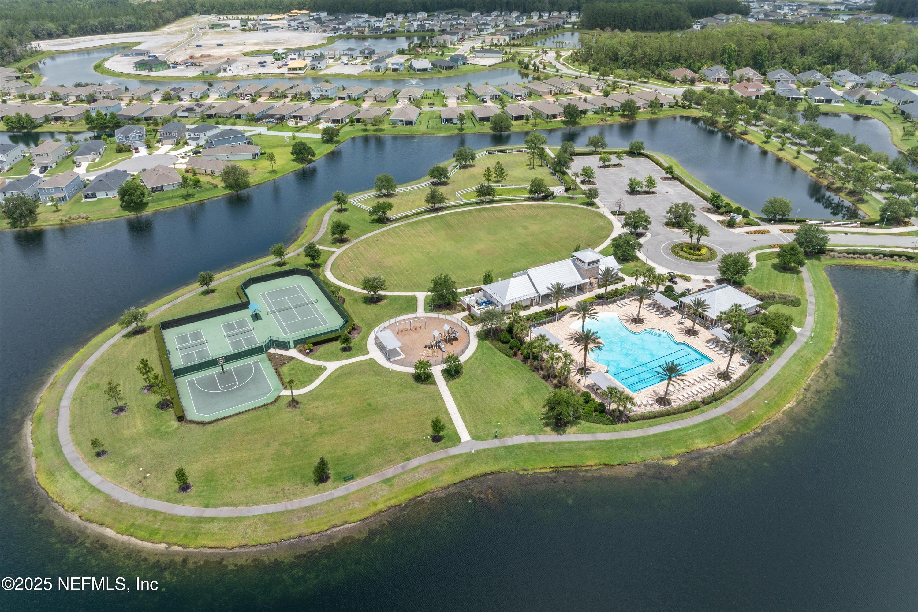 219 Bluejack Lane St. Augustine, FL 32095 - Photo 4 of 44 a view of a swimming pool in a back yard of the house