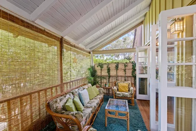 a bedroom with a bed and a view of walk in closet