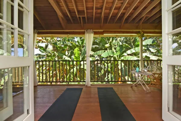 a view of a porch with wooden floor