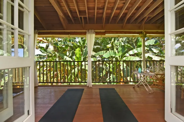 a view of a porch with wooden floor