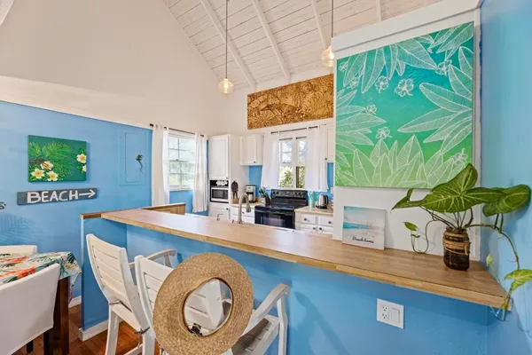 a very nice looking dining room with a table and chairs