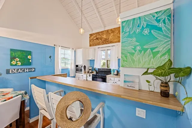 a very nice looking dining room with a table and chairs