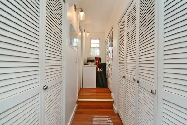 a blue and white umbrella sitting in front of a building