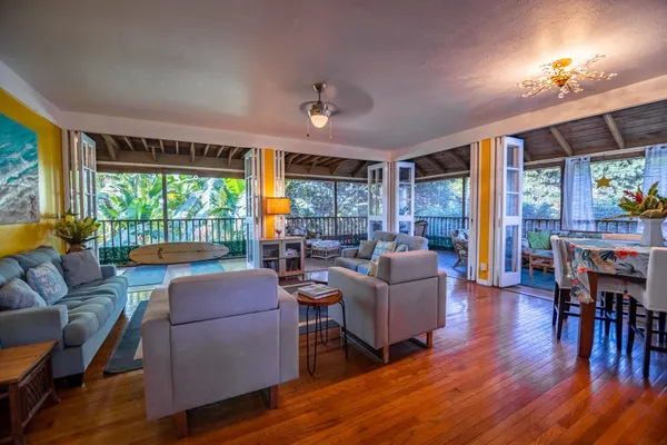 a living room with furniture and a potted plant