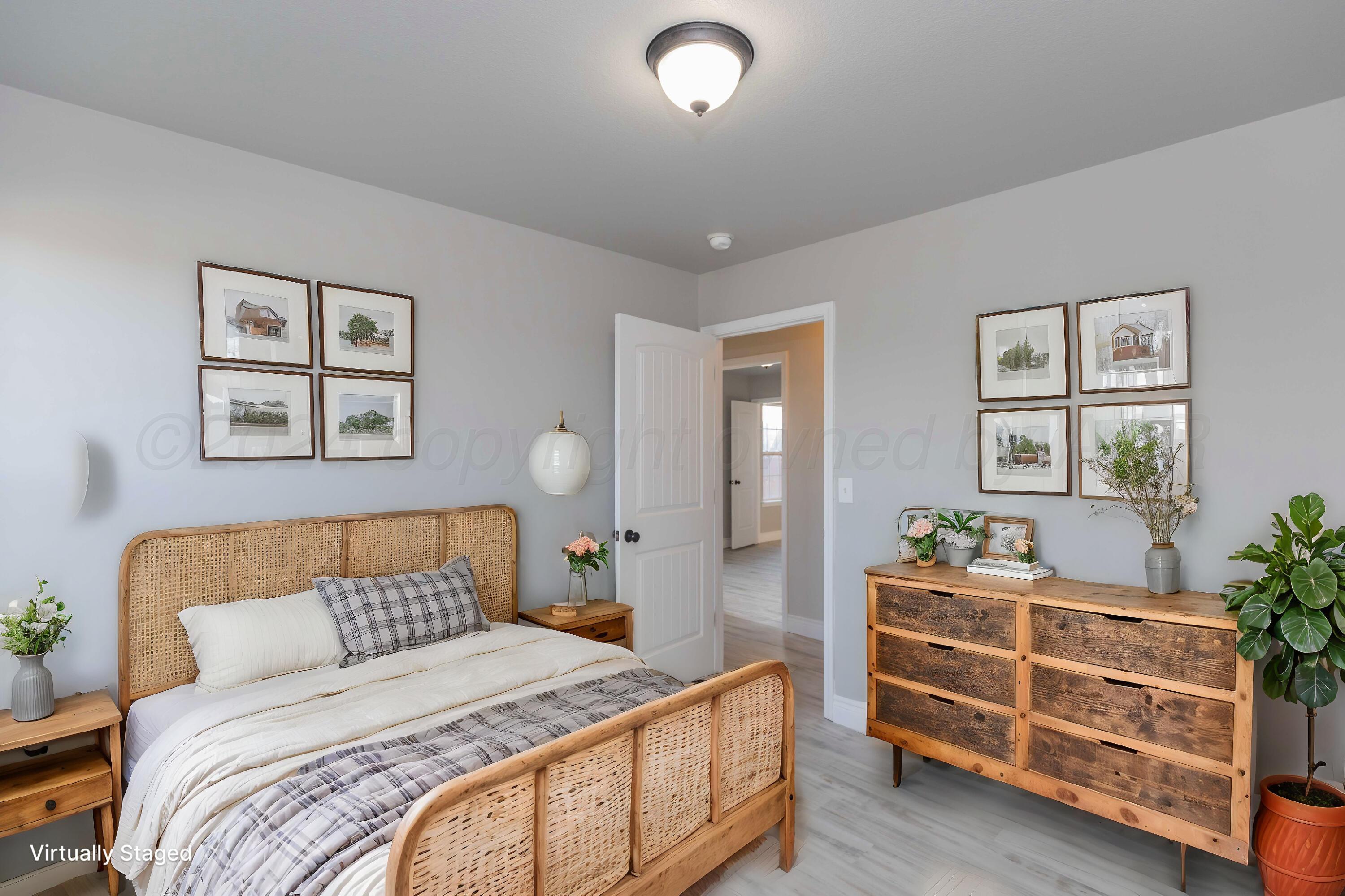 2805 Ries Lane Amarillo, TX 79118 - Photo 21 of 38 a bedroom with a bed and a couch