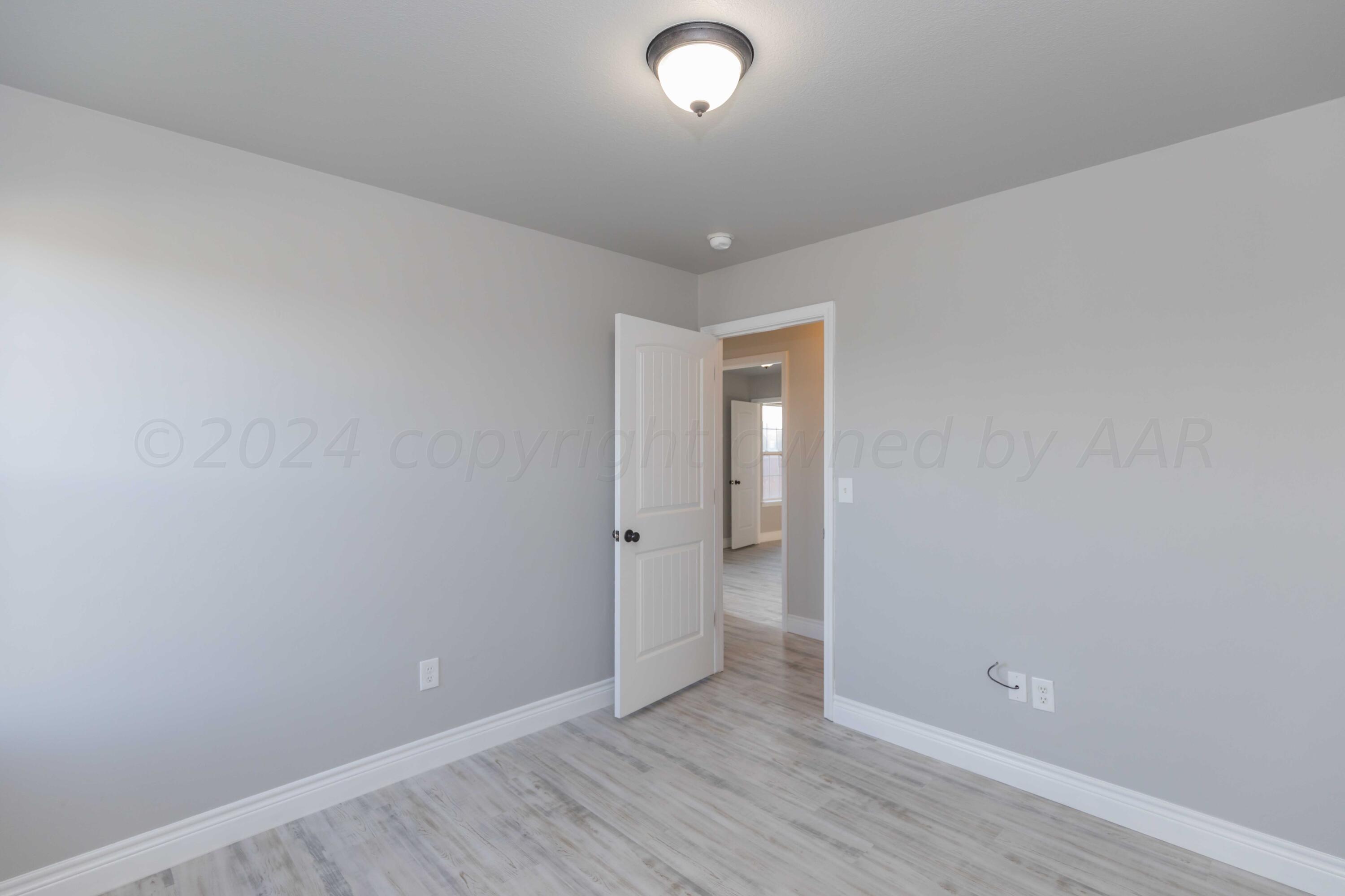 2805 Ries Lane Amarillo, TX 79118 - Photo 22 of 38 wooden floor in an empty room